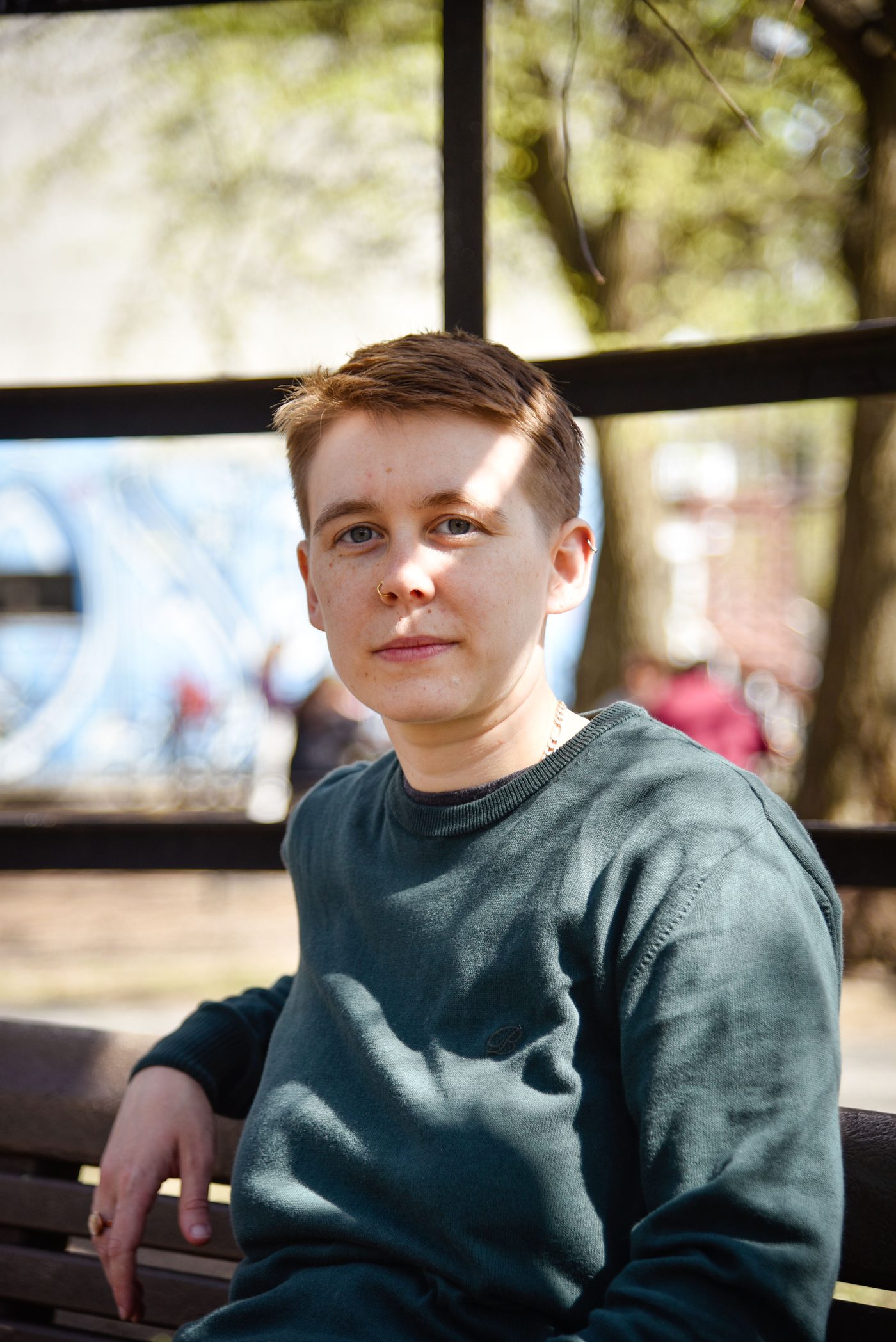 Portrait of Filip sitting outdoors, looking toward the camera.